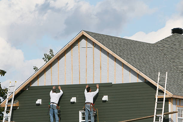 Professional Siding technician working in Mims, FL